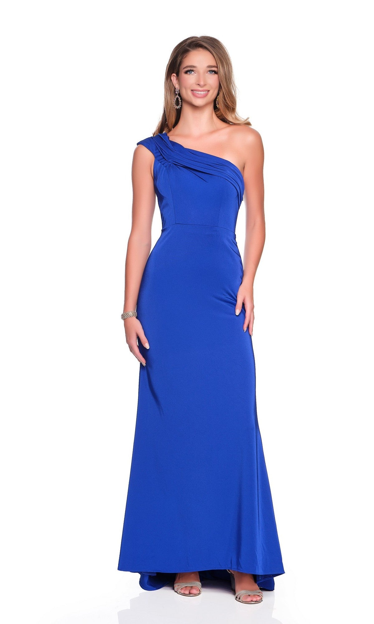 A woman models the Long Prom Dress: Dave and Johnny 12405—sleeveless, royal blue, one-shoulder style—with open-toe heels against a plain white background.